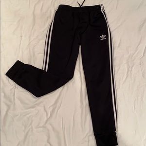 Black Adidas athletic joggers with zip pockets